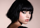 Prodotti di make-up assortiti del marchio Diego dalla Palma, tra cui rossetti, matite, mascara, smalti per unghie, palette di ombretti, fard in stick e lucidalabbra, disposti su uno sfondo bianco.