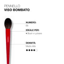 A red Pennello viso bombato 66 makeup brush, designed for blush application with its compact bristles and medium-high density, is displayed against a white background with descriptive text.