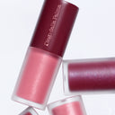 Three tubes of Diego dalla Palma nail polish in assorted pink and berry shades are arranged diagonally on a white background—ideal for pairing with Not So Innocent - Olio Gel Labbra to achieve a coordinated look and keep your lips hydrated all day.