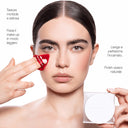 A model uses a triangular red puff to apply Cipria in Polvere Levigante to her under-eye area while holding a square compact.