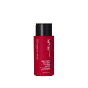 Red cylindrical bottle of Shampoo Riparatore with a black flip-top cap.