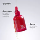 Flacone rosso satinato con contagocce, siero rinforzante capelli, gocce trasparenti pendenti.