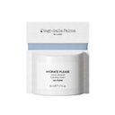 A white jar of Crema Idratante by Diego dalla Palma HYDRATE PLEASE, 50 ml, with a white and blue box in the background—perfect as a crema gel viso and ideal as a base trucco for every skincare routine.