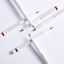 Five white Stain With Me Lip Marker - Penna di Precisione Contorno Labbra, featuring red accents and “Diego dalla Palma 12” label, form a star on a white background; their lunga tenuta formula ensures lasting, hydrating comfort.