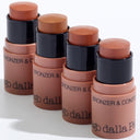 Four ALL IN ONE - BRONZER  CONTOUR sticks in assorted shades, displayed diagonally on a white surface with their caps off to reveal the product inside—ideal for precise contouring and achieving a flawless make up viso.